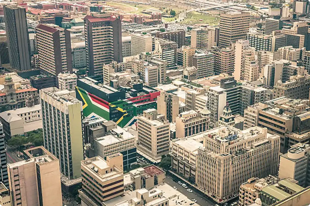 City of Johannesburg with the South African Flag painted on the sides of one building in the middle